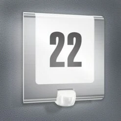 Steinel LED-Sensor-Außenwandleuchte L 220 S EDELSTAHL 9,3 W, L X B X H: 25,1 X 24,6 X 8,4 Cm, Edelstahl, Warmweiß -Beleuchtung 12 3433